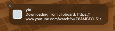 A macOS notification from ytd: Downloading from clipboard